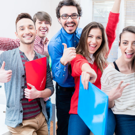 Group of students celebrating success in exams